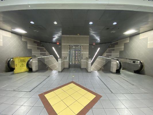 Highest underground floor at the station, has a diagonal, incline elevator And some escalators