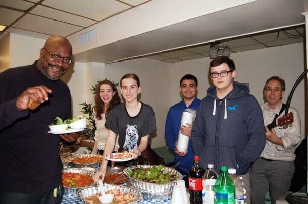 Volunteers sharing a meal with the shelter men!