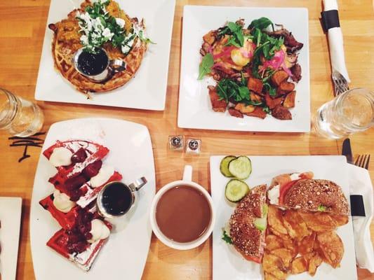 Clockwise from top right: carnitas eggs benedict, nova bagel, red velvet waffles, chicken and waffles