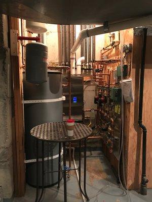 Replacing an old muti-zone boiler system with a new custom boiler, piping and indirect fired water heater.