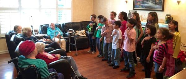 Kids choir singing for us.