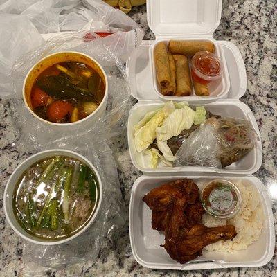 Takeout order delivered by UberEats. Clockwise: eggrolls, papaya salad, bbq chicken, tom yum soup, keung nai soup.