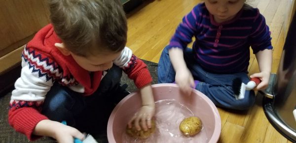 Washing potatoes.