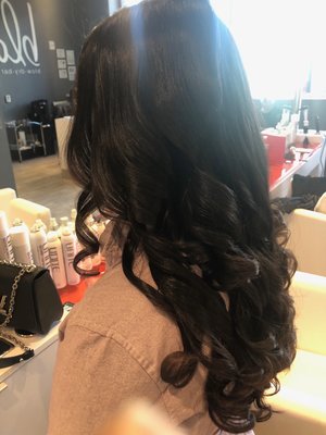 Long gorgeous hair curled to perfection