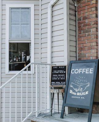 Temporarily parked coffee cart serving thru a pickup window! Gratuities only.