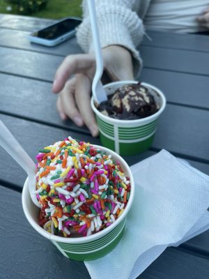 Junior dirty water with hot fudge and soft serve twist with rainbow sprinkles