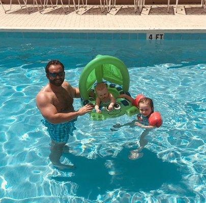 Enjoying one of the pools provided on the resort.