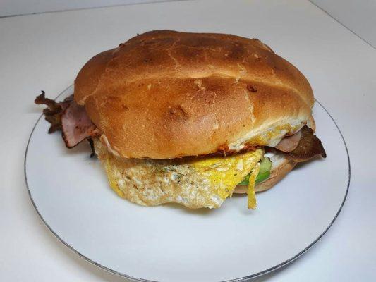 Torta Cubana

-Breaded thin beef
-Hotdog 
-Egg
-Pineapple 
-Ham
-Onion 
-Tomato
-Mayo
-Avocado
-Chorizo 
-Melted cheese