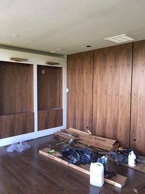 Custom build Walnut Book matched bookcases lacquer exterior and walnut paneling before clean up..E.H & Co /Walker Design and K&K