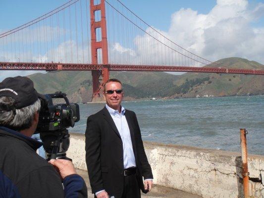 Opening Moments Media Corporation capturing a video with a client on site at the Golden Gate Bridge in CA.