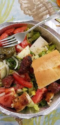 Greek salad with chicken and pork souvlaki