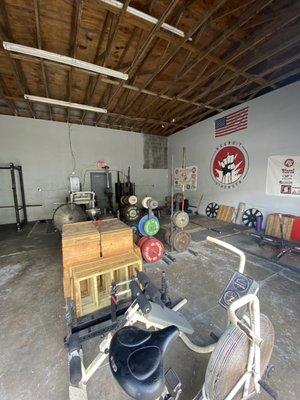 Platforms in the back area for deadlifting and olympic lifting.