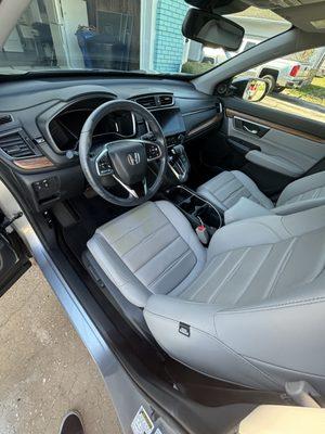 Seats were treated for leather care and vacuumed.