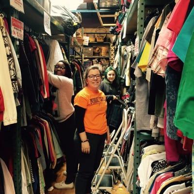 Volunteers sorting and hanging new clothes every day.