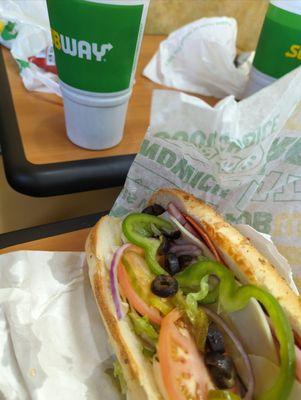 Italian BMT with lettuce, onion, olives, green pepper and pickles on an Italian herbs and cheese bread. YUM!