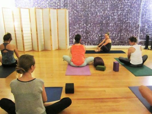 Teacher trainees student teaching in a Yoga Teacher Training