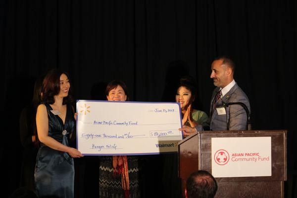 Annual Fundraising Gala 2017, APCF's Executive Director, Debra Fong, receiving a donation from the Walmart Foundation.