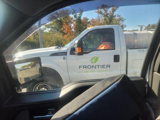 Frontier employee driving with tailgate open letting bottles of chemicals fall out on 28 Southbound during rush hour on a Friday