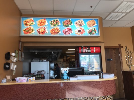 A Chinese takeout place without colorful pictures of food over the counter would be just plain wrong