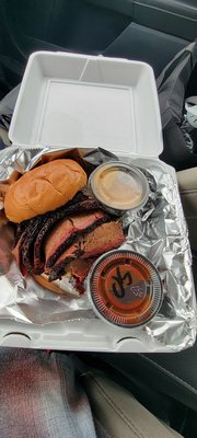 Brisket sandwich with hot bbq and white BBQ sauce. What dreams are made of!