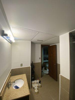 repaint bathroom and install drop ceiling tile.