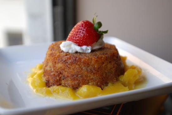 TORTA DE MANQUEÑO. Sweet plantain and amaretto cupcake on a seasonal fruit compote.