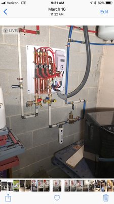 24 Kw Rheem tankless water heater installation and anti descale inhibitor filter.