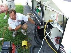 Looking at the mobile camera to verify the tank is cleaned.