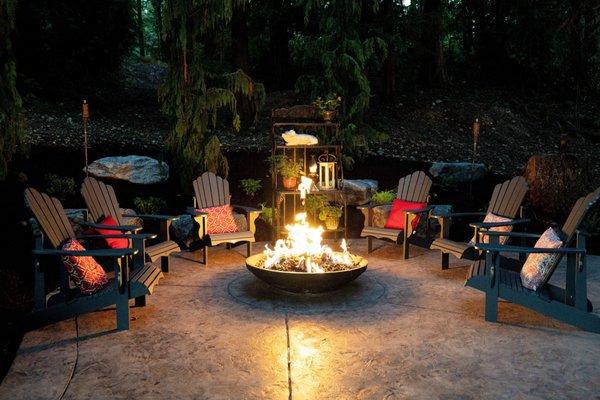 Gas firepit with Adirondack chairs to catch up with friends and family