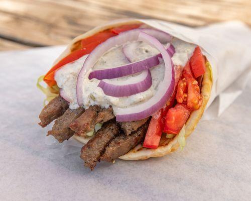 Gyro Wrap
Our sizzling top-quality gyro lamb meat is topped with fresh tomatoes, lettuce, and onions. Don't forget our unique fresh t