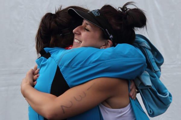 We did it!  Mother-Daughter triathlon finish line hugs.