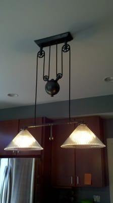 Urban Handyman JUST installed this stupidly-complicated & heavy pendant light over our island. He did it with no problem.