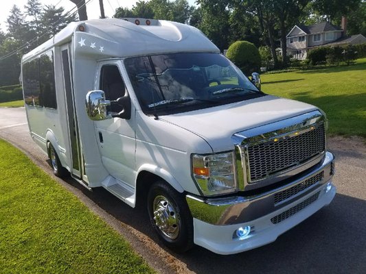 Our white 15 passenger luxury van bus