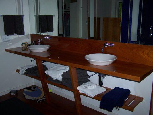 Custom Teak vanity with vessel bowl sinks and high gloss marine finish