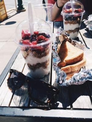 A yogurt parfait to-go with a side of toast.