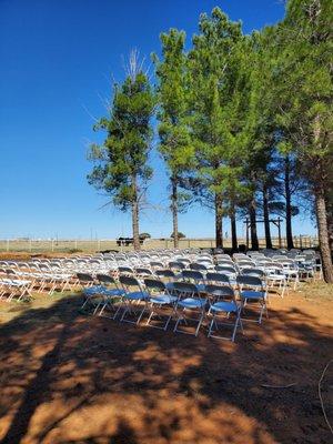 Wedding set up for ceremony. White chairs