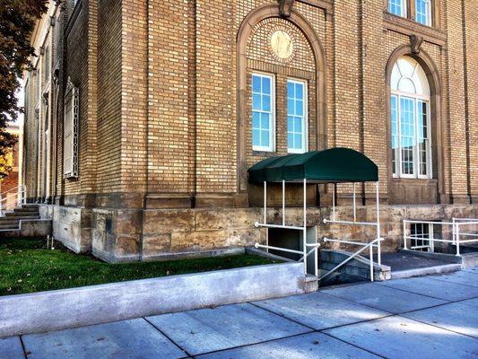 Enter our suite under this canopy on the north side of the building.