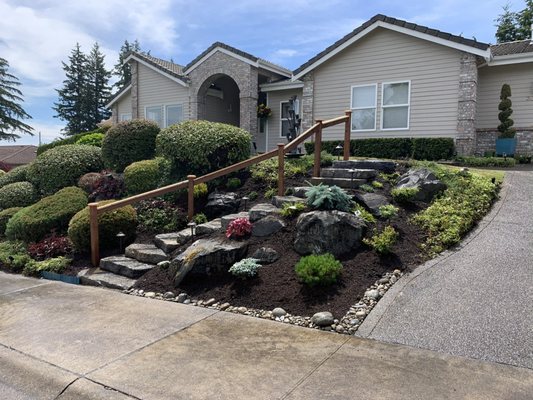 New steps to front door with railing. Built by Garland Landscape!