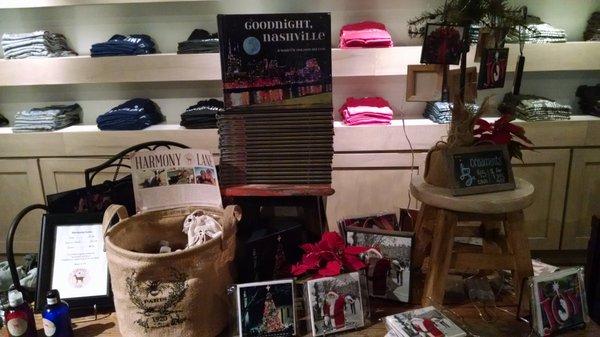 Souvenir items including CDs, ornaments and tees.