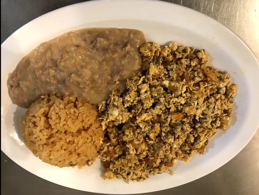 One of our variations of Huevos al Gusto, eggs mixed with pork sausage, accompanied by a side of rice and beans.