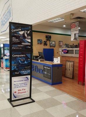 Entrance to Flux Computer Repair located within Meijer