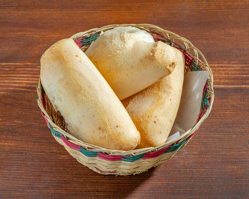 Enjoy the crispy exterior and soft, chewy center that melts in your mouth with every bite of our Pan de Yuca!