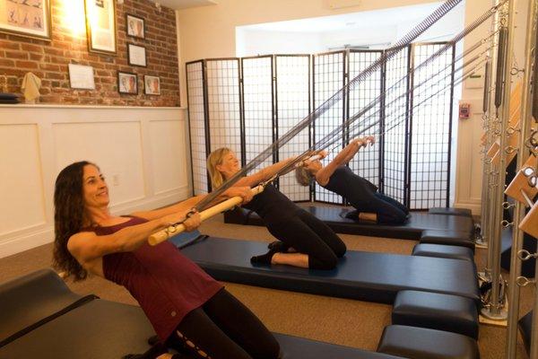 Clare Ellinwood, June Hines, Katy Dawley in the thigh stretch