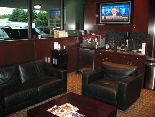 State of the art waiting area with HD TV and complementary cappuccinos