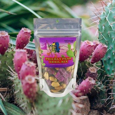 Prickly Pear Trail Mix 3oz is a blend of peanuts, cashews, pecans, almonds, raisins, and chunks of organic prickly pear candy.