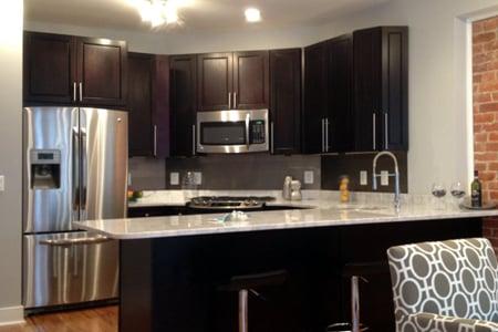 Espresso Maple cabinet with Supper White Quartzite counter top and aluminium back splash in 9th NW Washington DC