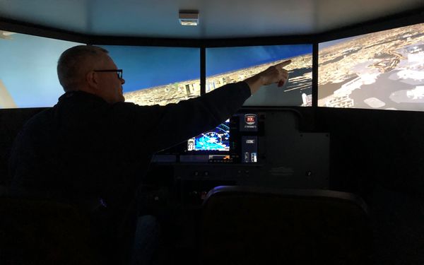 Wings Level Aviation Group Founder David Vail doing an approach to Logan Airport in the Redbird Flight Simulator in Norwood Massachusetts