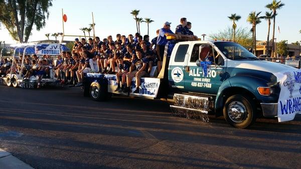 ALL PRO TOWING SHOWING SUPPORT FOR THE F.H. HIGH SCHOOL FOOTBALL TEAMS IN THE 2014 HOMECOMING PARADE.