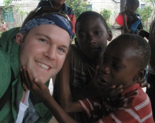 Dr. Thomas Dickert spreading chiropractic to some young Hatian villagers on a chiropractic mission trip.