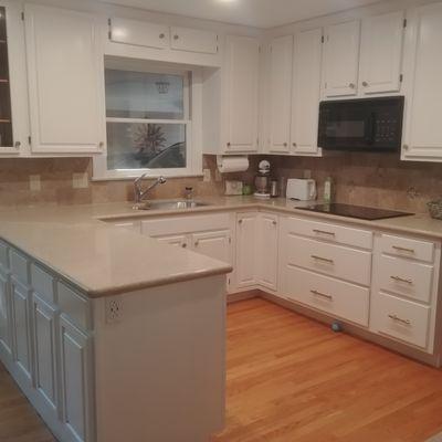 Refinished Oak cabinets with Spray fill.